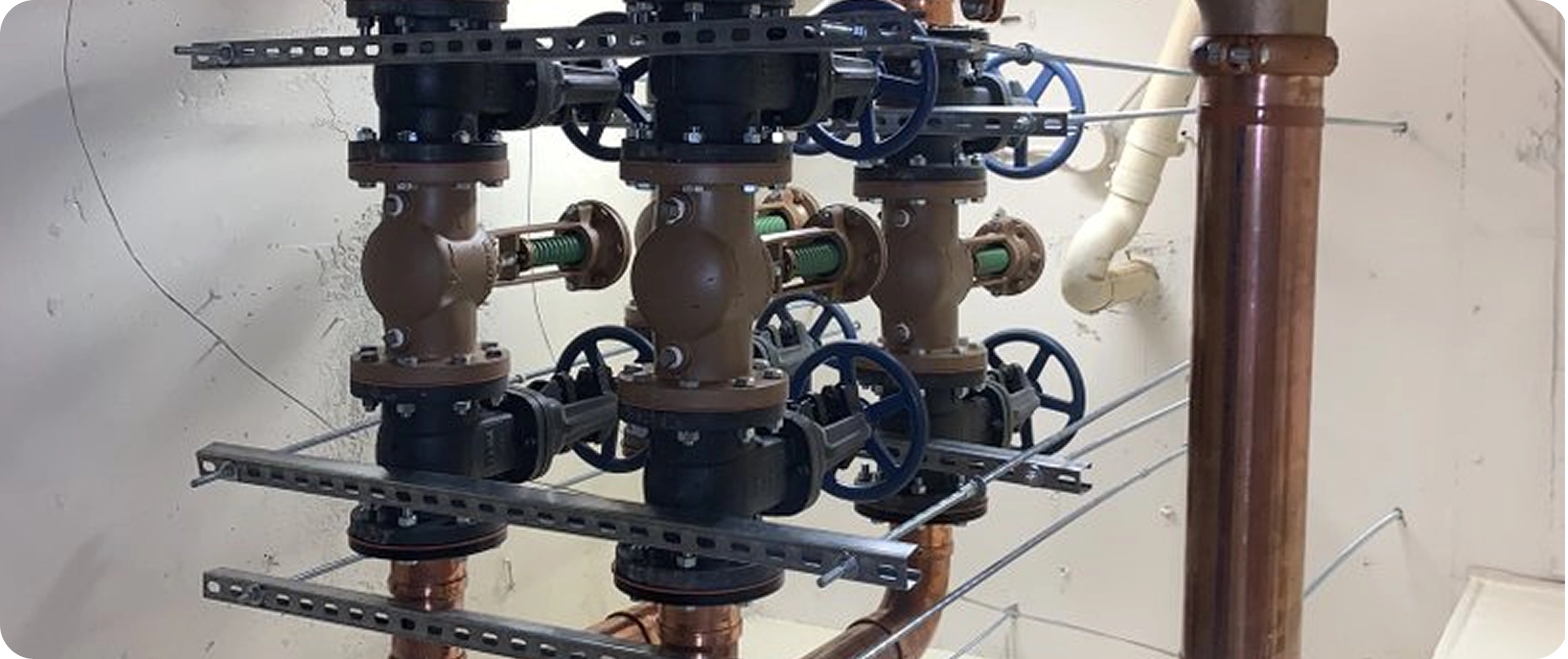 Technician handling pipe equipment