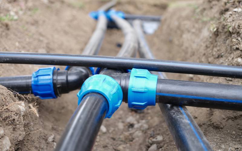 New HDPE sewer pipe with compression fittings installed in a Miami underground plumbing project