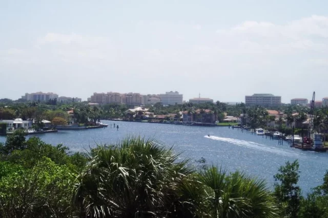 boca-raton-waterfront-downtown-skyline-blog Boca Raton waterfront canal with downtown skyline and palm trees